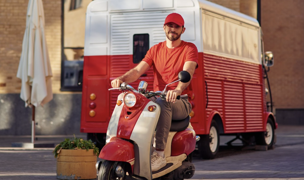 delivery driver on his way to work on a scooter